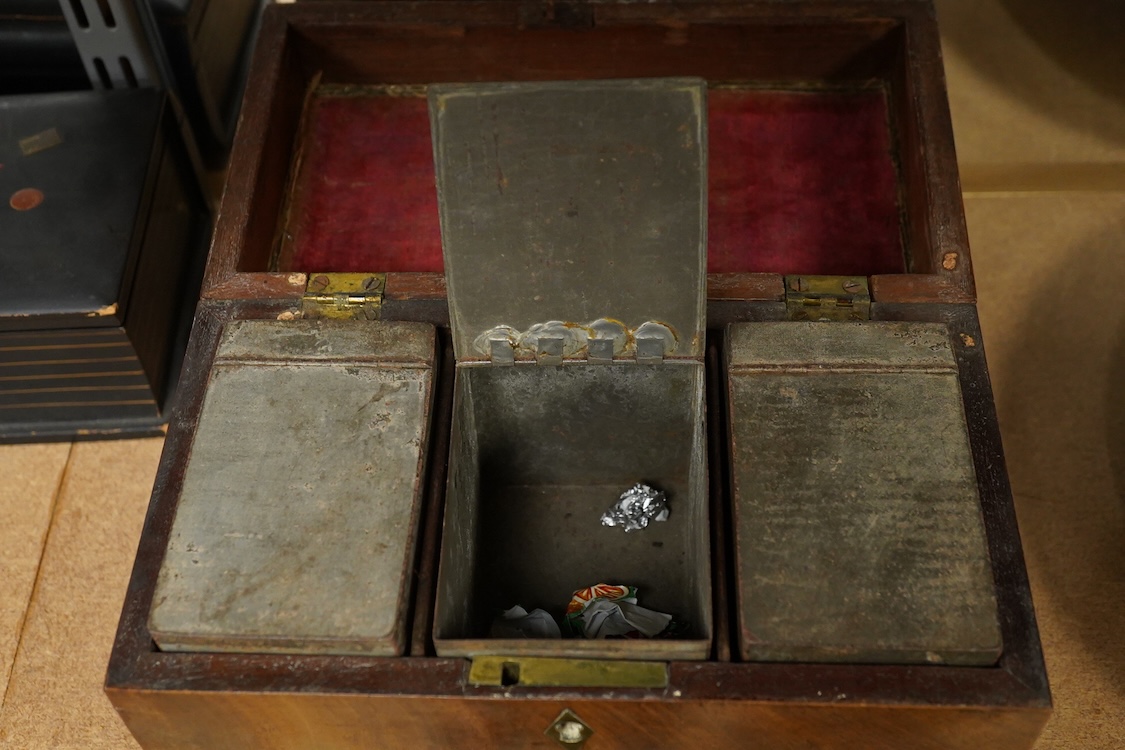 A George III mahogany tea caddy, containing tinned metal canisters, 25cm wide